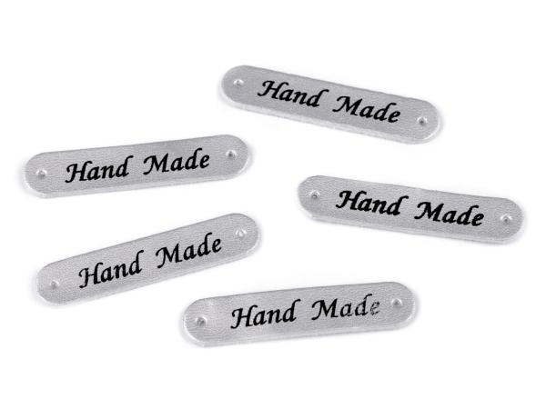Applikation aus Kunstleder Silbermetallic Schrift Hand Made ca. 10x48 mm